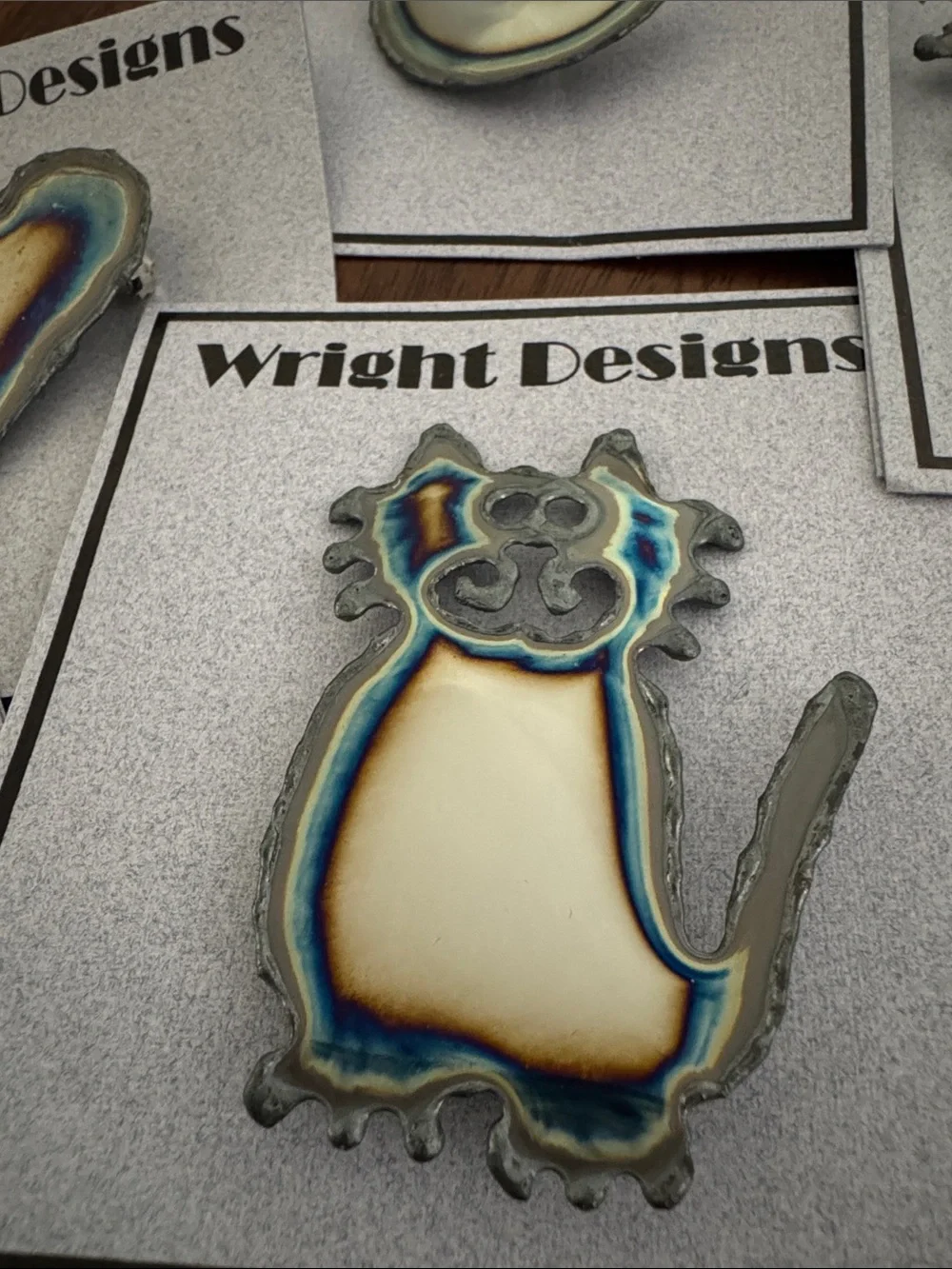 Brooches. Each piece is handcrafted. individually cut out of chrome plated steel